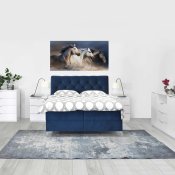 Boxspring krevet Deluxe namješten u ambijentu slikan s prednje strane